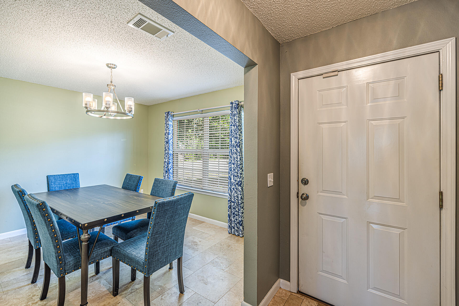 201 Lustan Drive Crestview, FL 32536 - Photo 17 of 34 a view of a dining room with furniture and chandelier