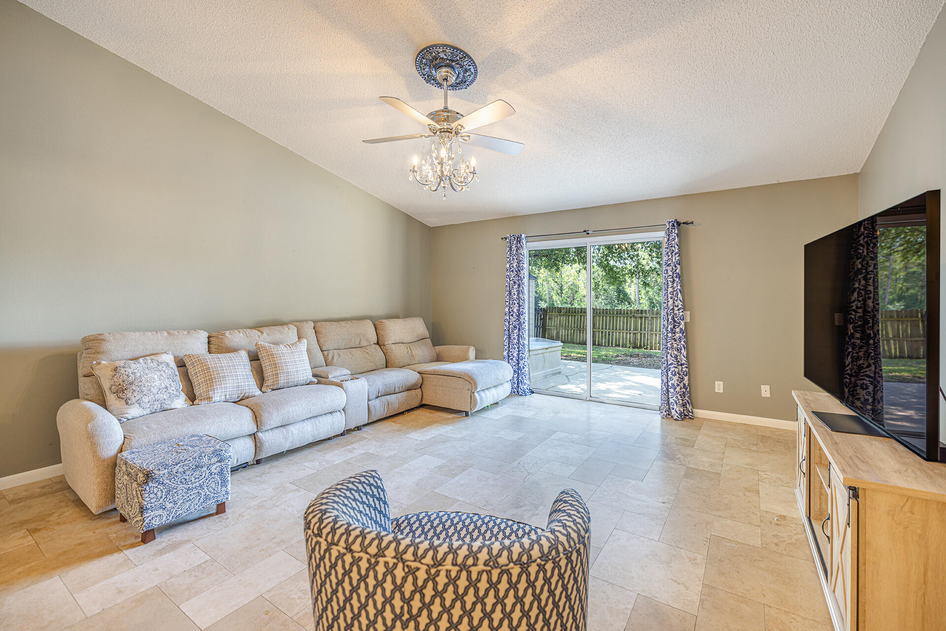 201 Lustan Drive Crestview, FL 32536 - Photo 23 of 34 a living room with furniture and a flat screen tv