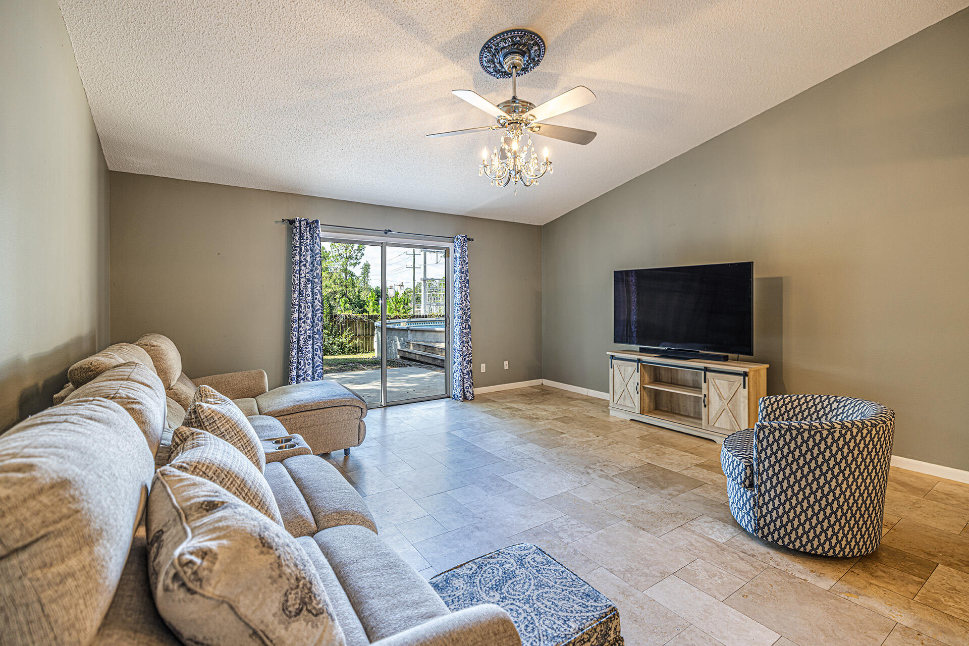 201 Lustan Drive Crestview, FL 32536 - Photo 24 of 34 a living room with furniture and a flat screen tv