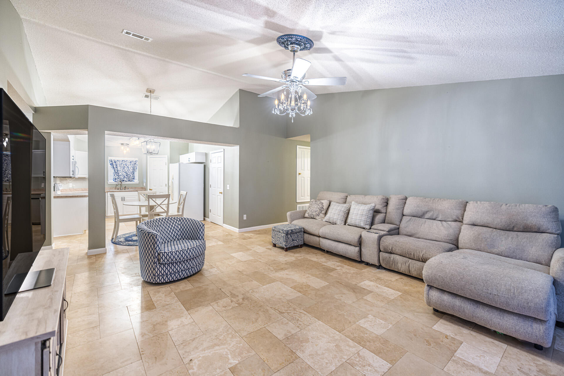 201 Lustan Drive Crestview, FL 32536 - Photo 25 of 34 a living room with furniture and a chandelier