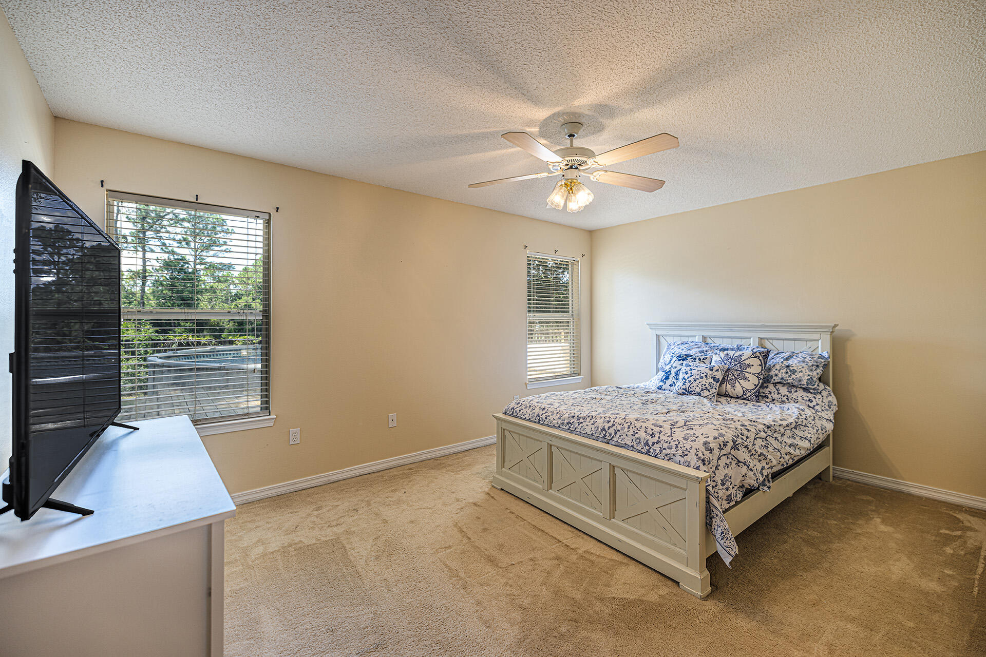 201 Lustan Drive Crestview, FL 32536 - Photo 27 of 34 a bedroom with a bed and a window
