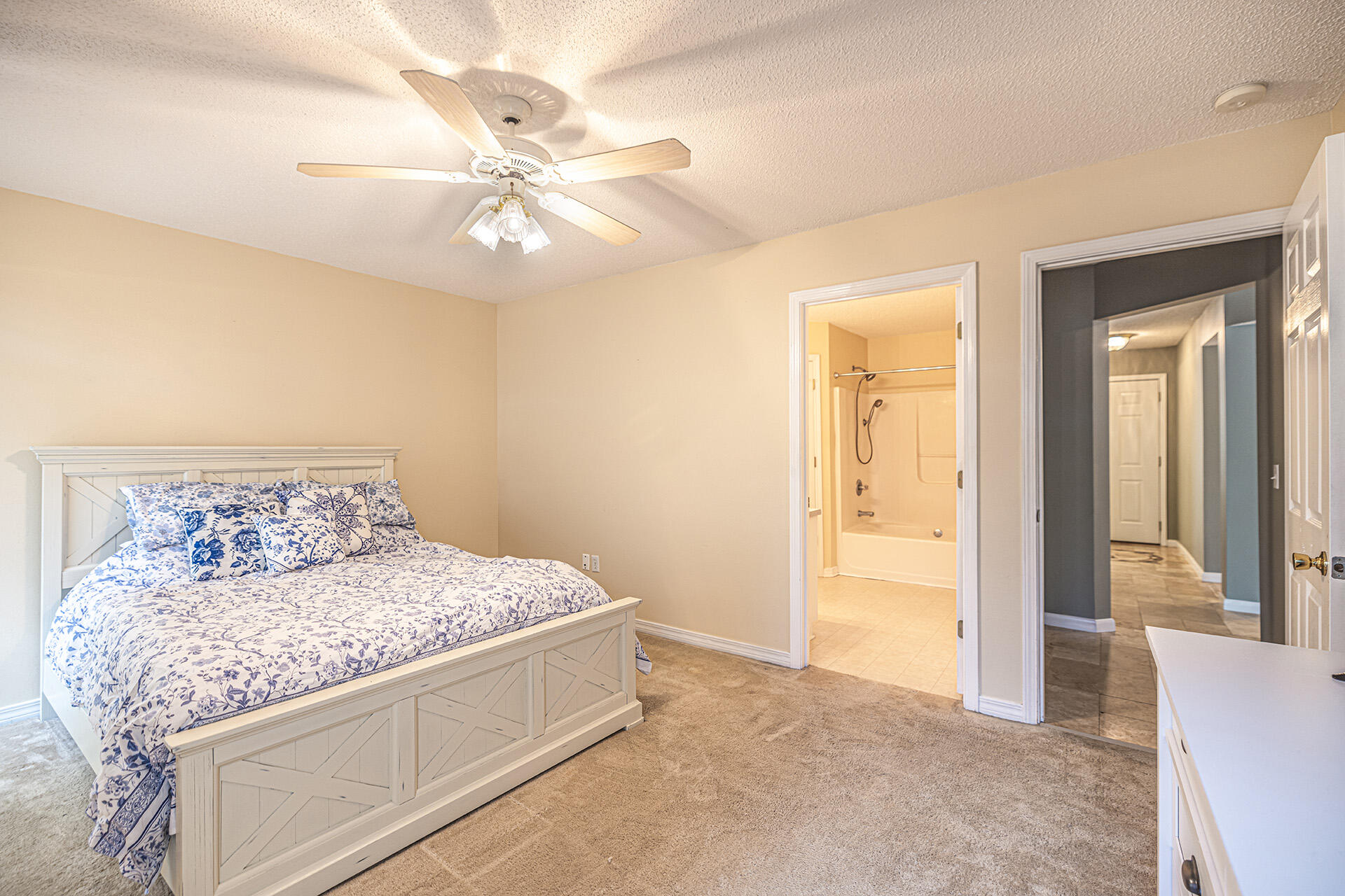 201 Lustan Drive Crestview, FL 32536 - Photo 28 of 34 a living room with a bed and a chandelier