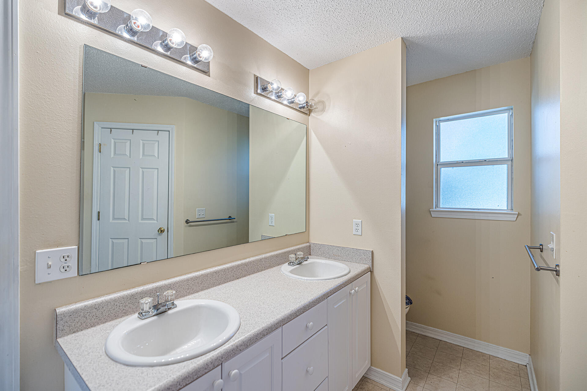 201 Lustan Drive Crestview, FL 32536 - Photo 30 of 34 a bathroom with a sink double vanity and a mirror