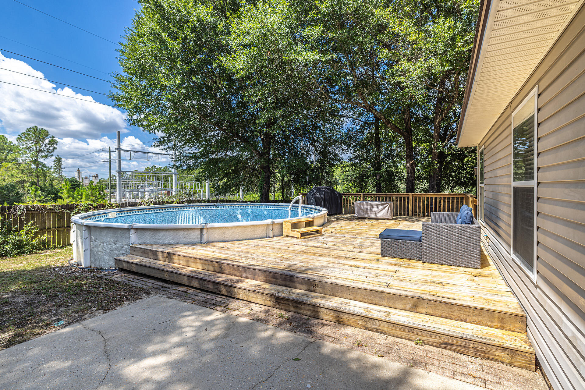 201 Lustan Drive Crestview, FL 32536 - Photo 10 of 34 a view of a swimming pool with a patio