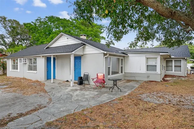 a house view with a sitting space and garden space