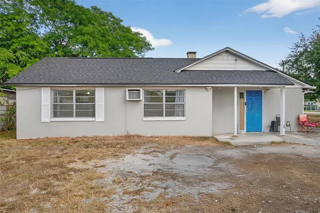 a house with trees in the background