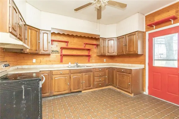 a kitchen with stainless steel appliances granite countertop a sink and cabinets
