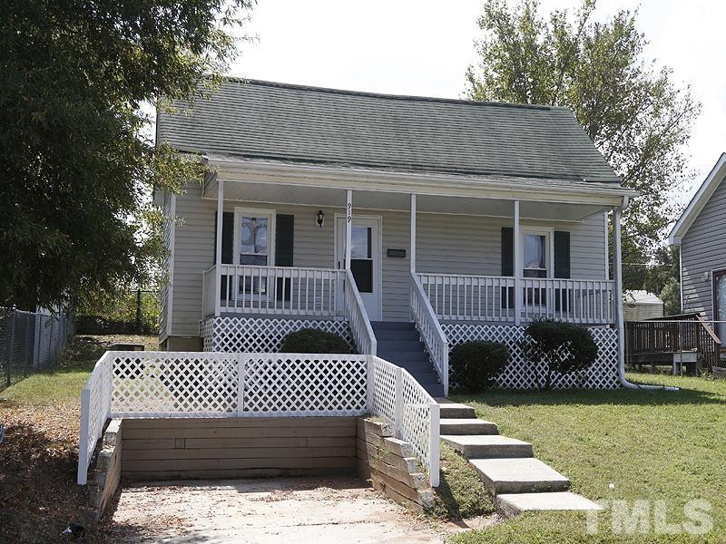 919 Dale Street Durham, NC 27701 - Photo 1 of 16 a view of a wooden deck and a yard with the potted plants
