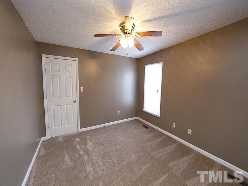 919 Dale Street Durham, NC 27701 - Photo 11 of 16 an empty room with windows and fan