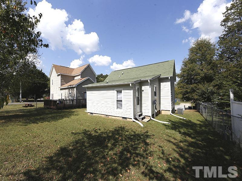 919 Dale Street Durham, NC 27701 - Photo 14 of 16 a front view of a house with a yard and garage