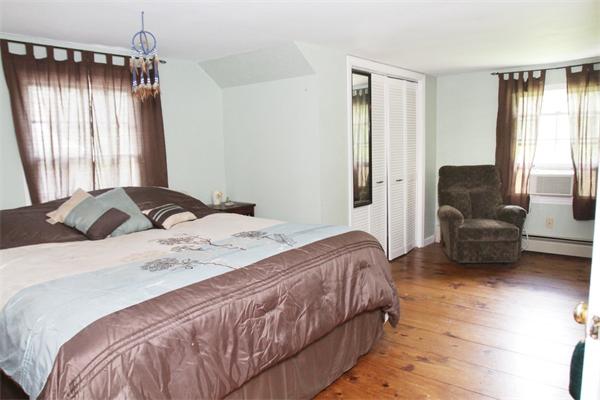 89 Newbury Road Rowley, MA 01969 - Photo 5 of 6 a bedroom with a bed and a couch