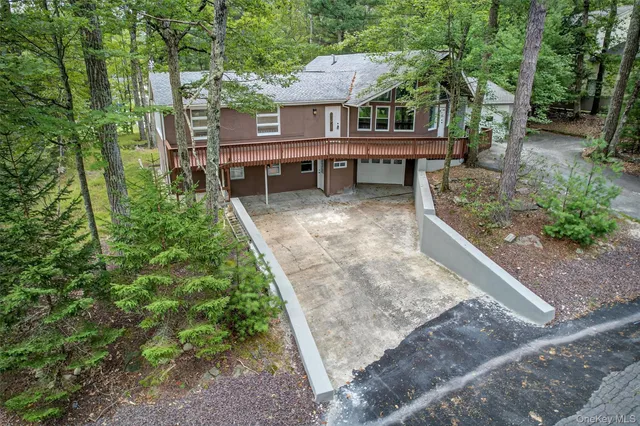 a view of a backyard with sitting area