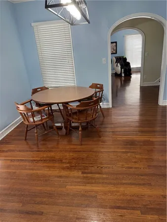 a view of a flesh screen tv and wooden floor