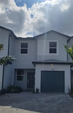 a front view of a house with a garage