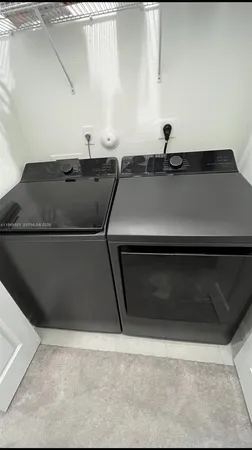 a sink sitting area with cabinetry