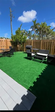 a view of a garden with an outdoor space