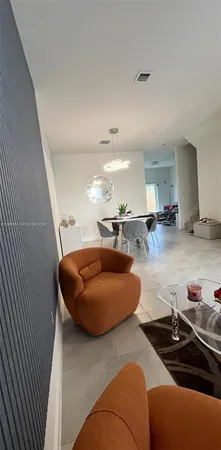 a room with furniture and a wooden floor