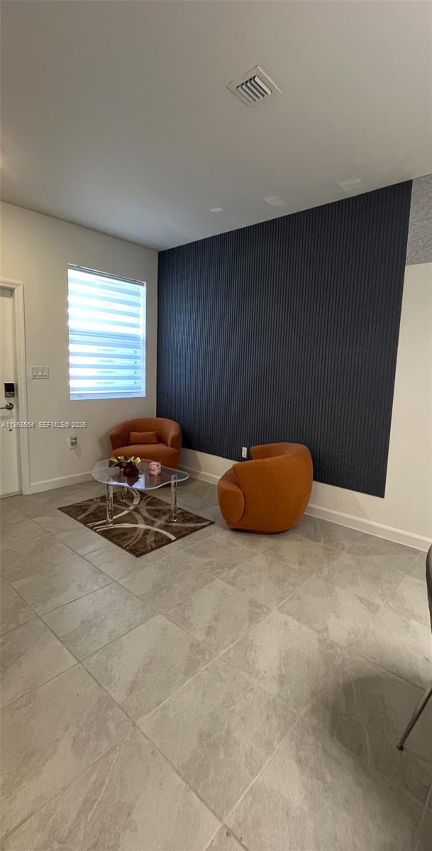 17982 Southwest 359th Street Homestead, FL 33034 - Photo 6 of 17 a view of a room with a table and a couch