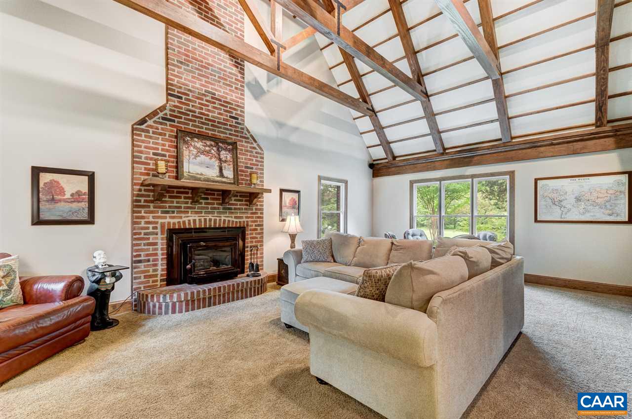145 Ivy Ridge Road Charlottesville, VA 22901 - Photo 15 of 50 a living room with furniture and a fireplace