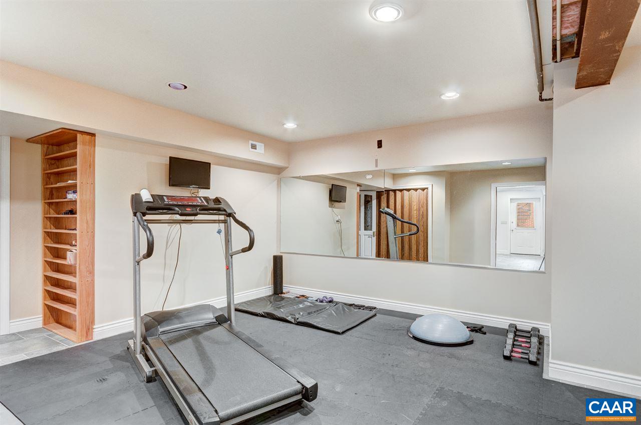 145 Ivy Ridge Road Charlottesville, VA 22901 - Photo 21 of 50 a room with furniture and gym equipment
