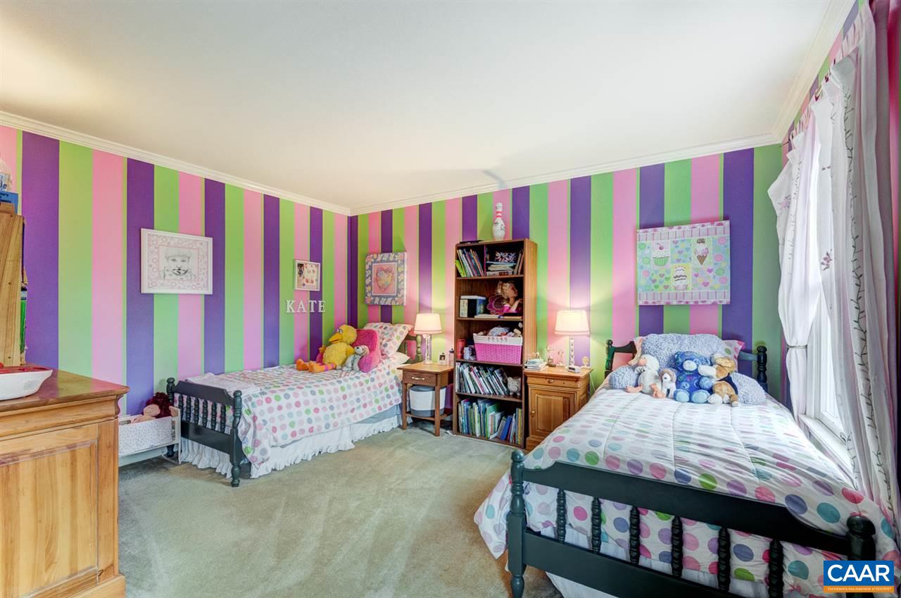 145 Ivy Ridge Road Charlottesville, VA 22901 - Photo 29 of 50 a bedroom with a bed and a chair
