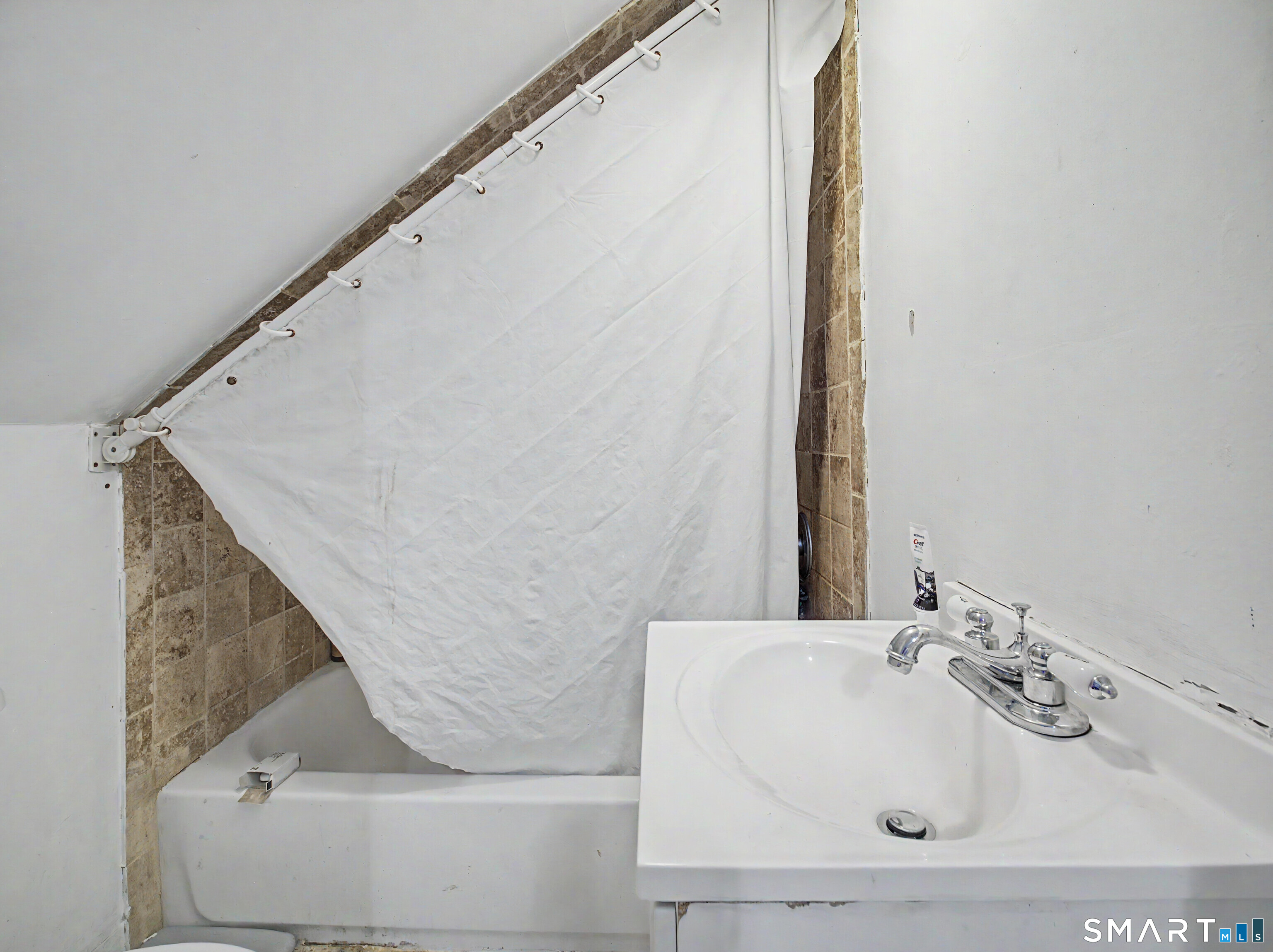 319 Carroll Avenue Bridgeport, CT 06607 - Photo 33 of 40 a bathroom with a white tub and shower