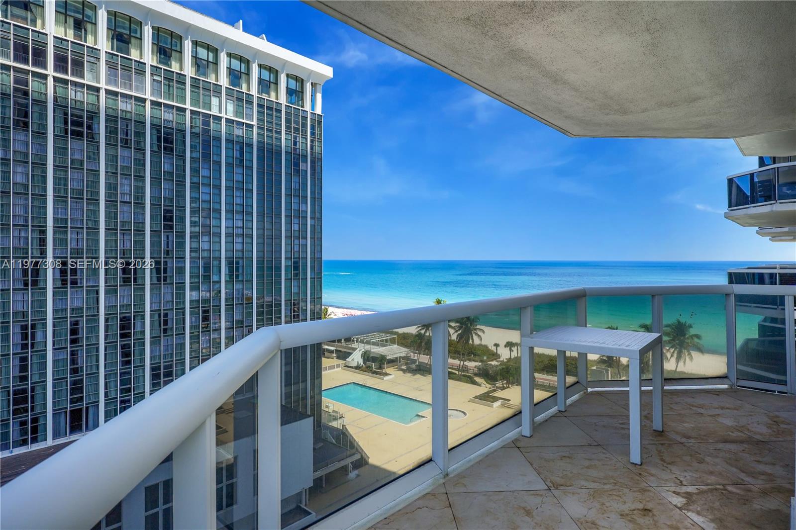4779 Collins Avenue, Unit 1007 Miami Beach, FL 33140 - Photo 12 of 56 a view of a balcony with an outdoor space