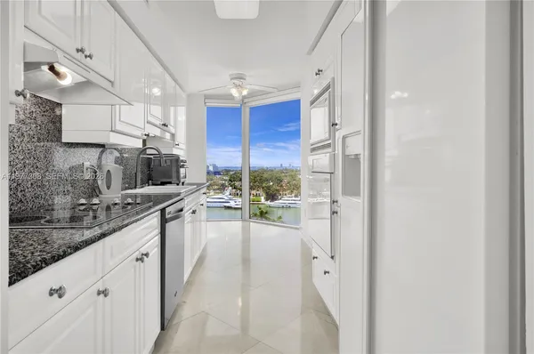 a kitchen that has a lot of cabinets in it