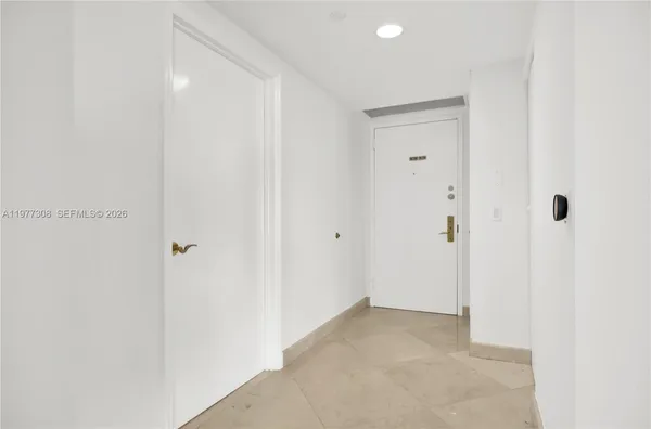 a spacious bedroom with a bed and a window