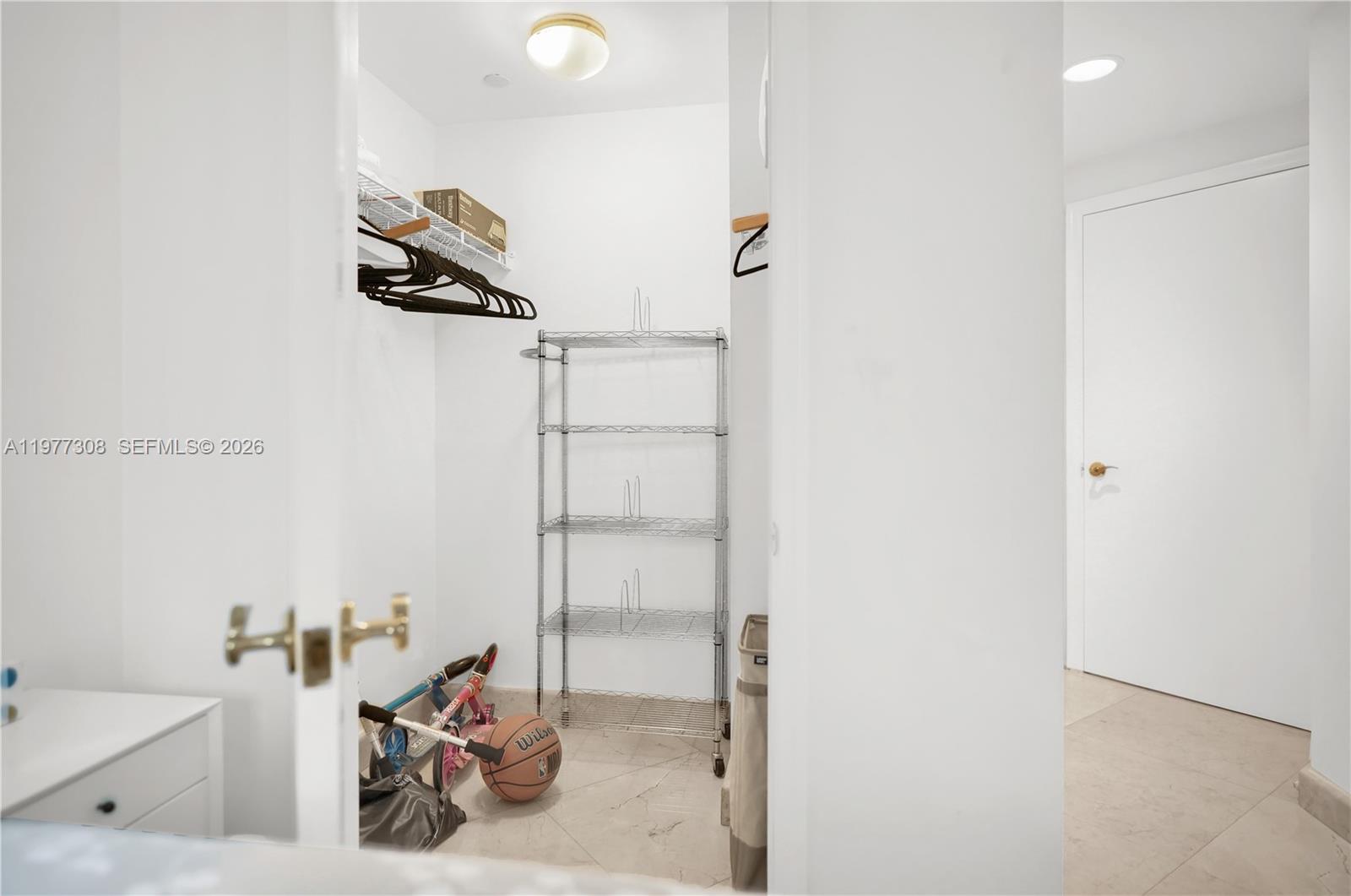 4779 Collins Avenue, Unit 1007 Miami Beach, FL 33140 - Photo 38 of 56 a view of a room with rack on the wall