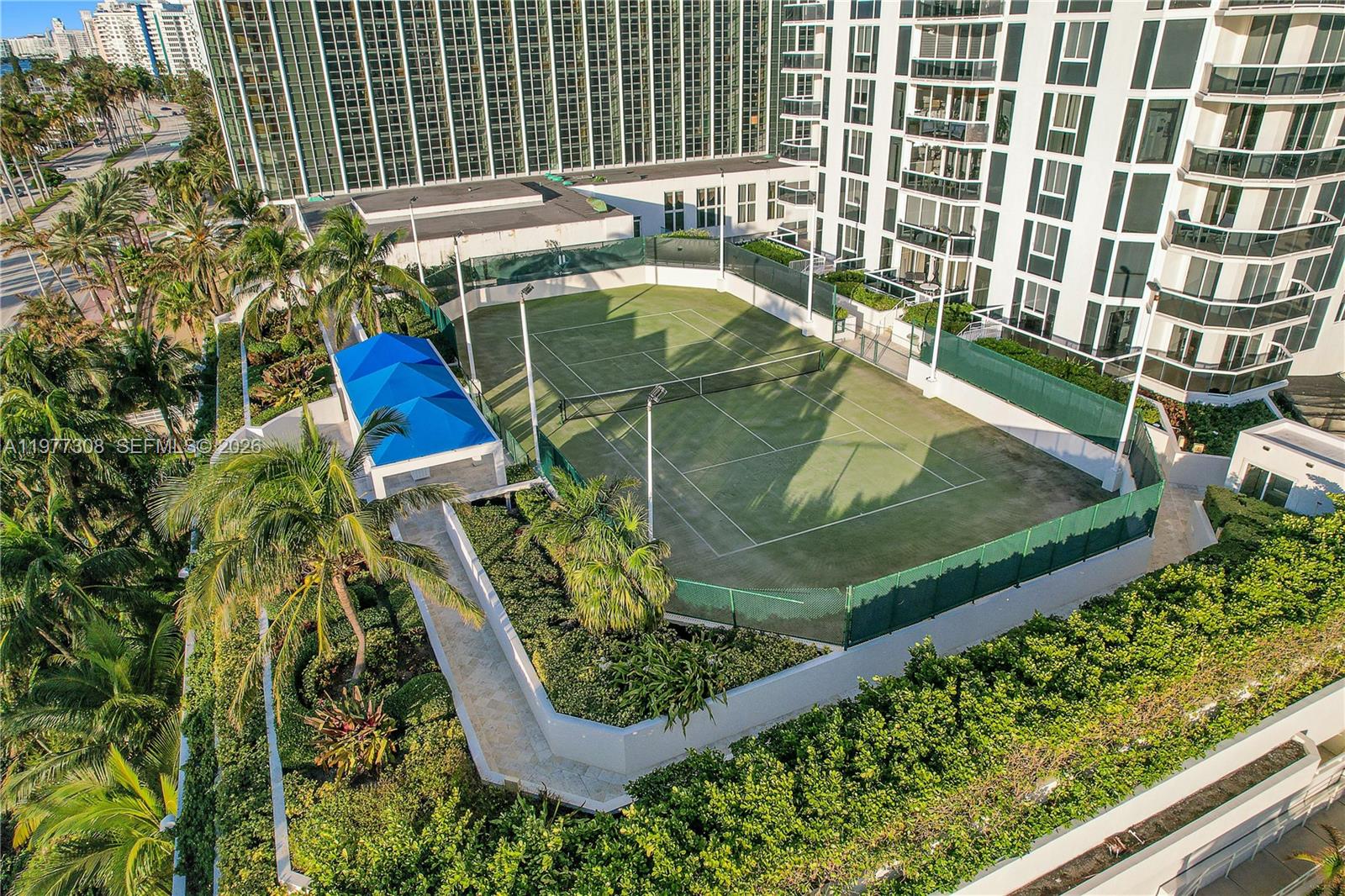 4779 Collins Avenue, Unit 1007 Miami Beach, FL 33140 - Photo 54 of 56 a view of a chairs and table in the balcony
