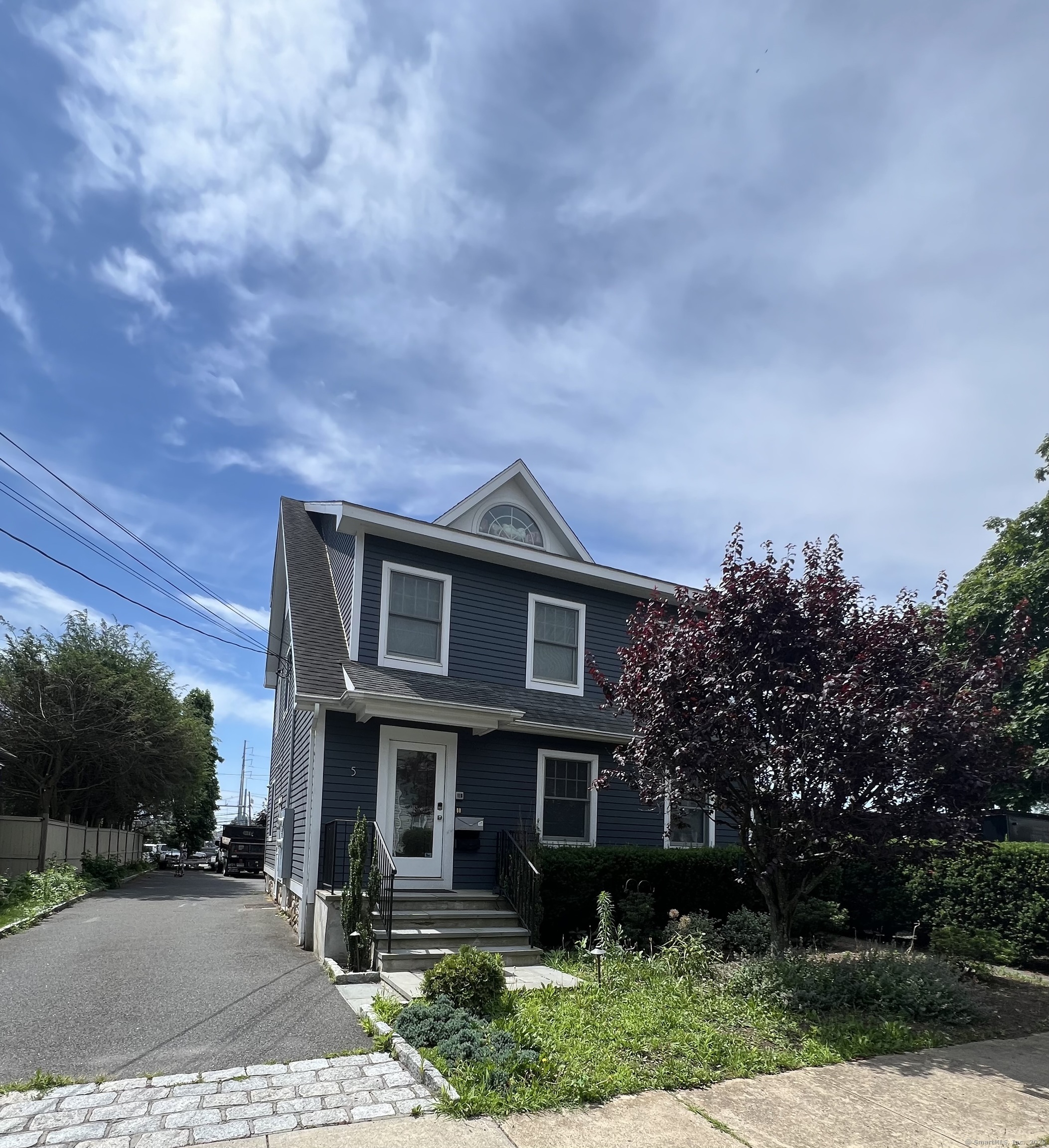 a front view of a house with garden