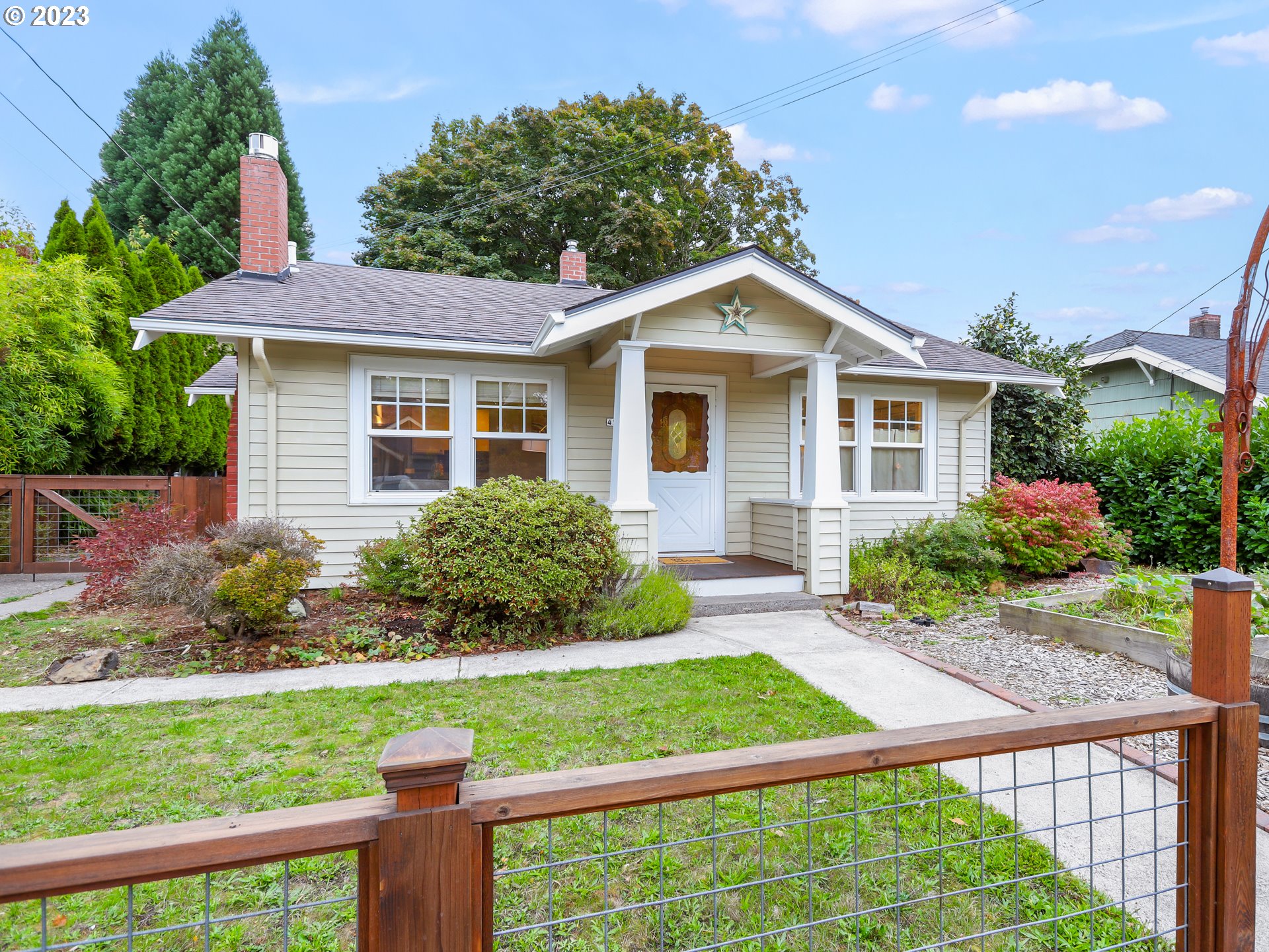 4524 Southeast 36th Place Portland, OR 97202 - Photo 2 of 41 a front view of a house with a yard