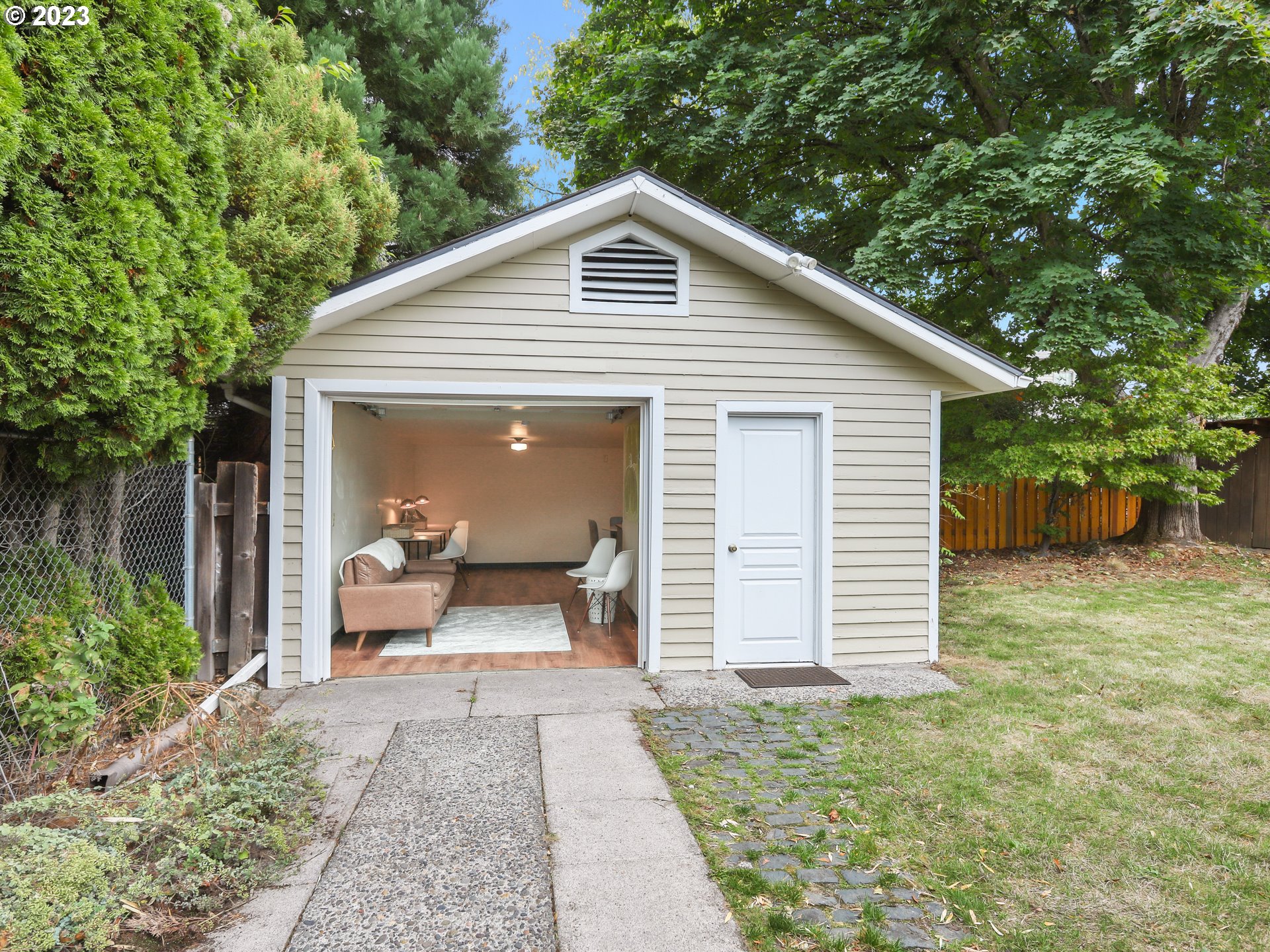 4524 Southeast 36th Place Portland, OR 97202 - Photo 27 of 41 a front view of a house with a yard