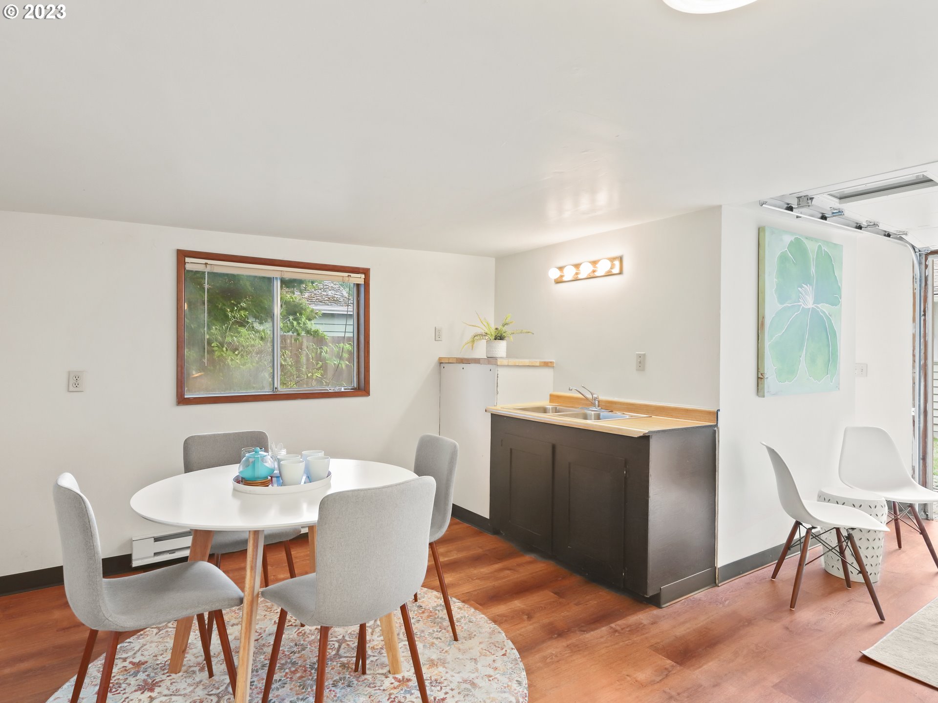 4524 Southeast 36th Place Portland, OR 97202 - Photo 29 of 41 a view of a dining room with furniture and wooden floor