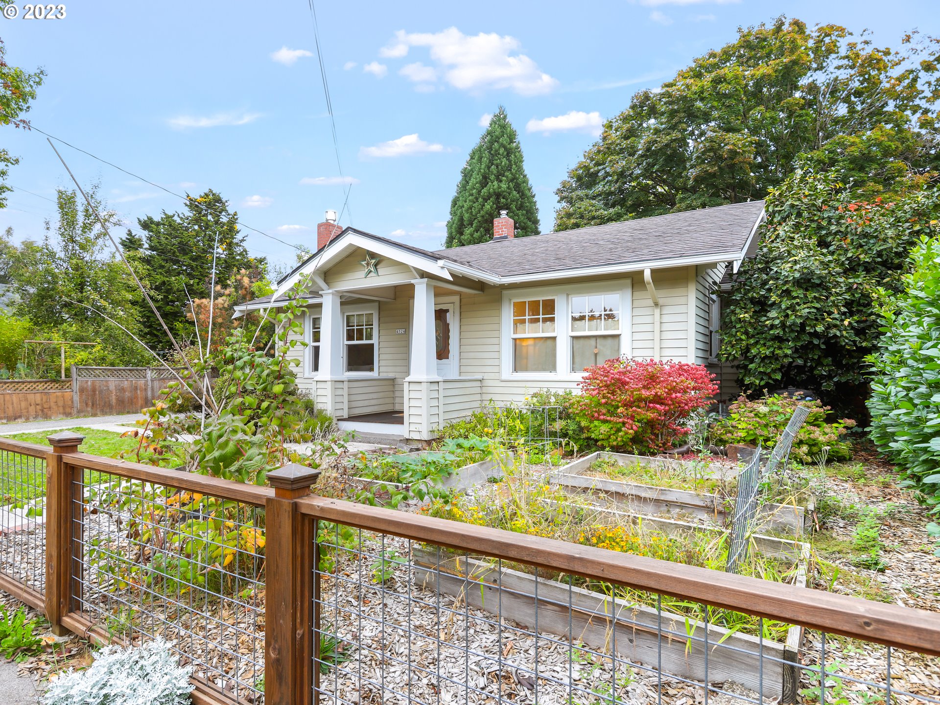 4524 Southeast 36th Place Portland, OR 97202 - Photo 3 of 41 a front view of a house with a yard and potted plants