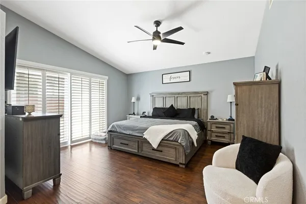 a bedroom with a bed and a couch