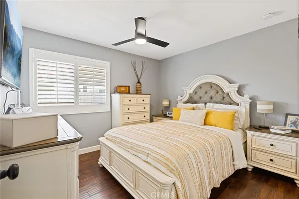 a bedroom with a bed and a dresser