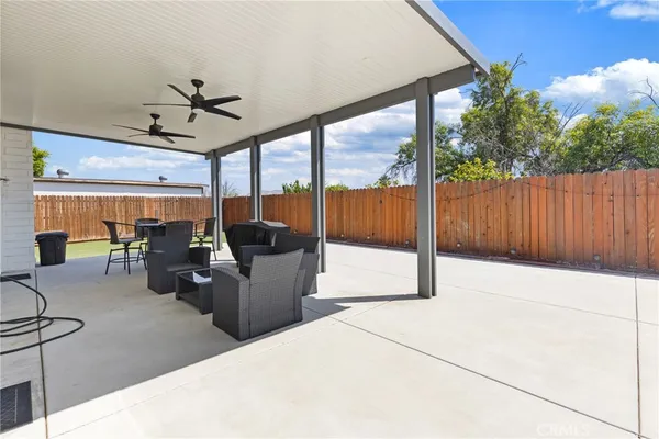 a view of a patio with a table and chairs