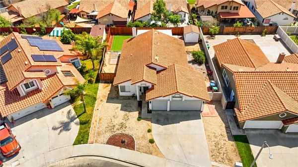 an aerial view of a house with a garden