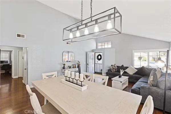 a large white kitchen with a large window