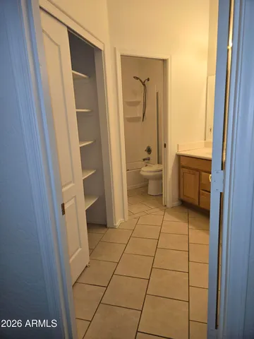 a bathroom with a sink a toilet and a shower