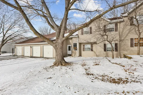 a big house with trees in front of it