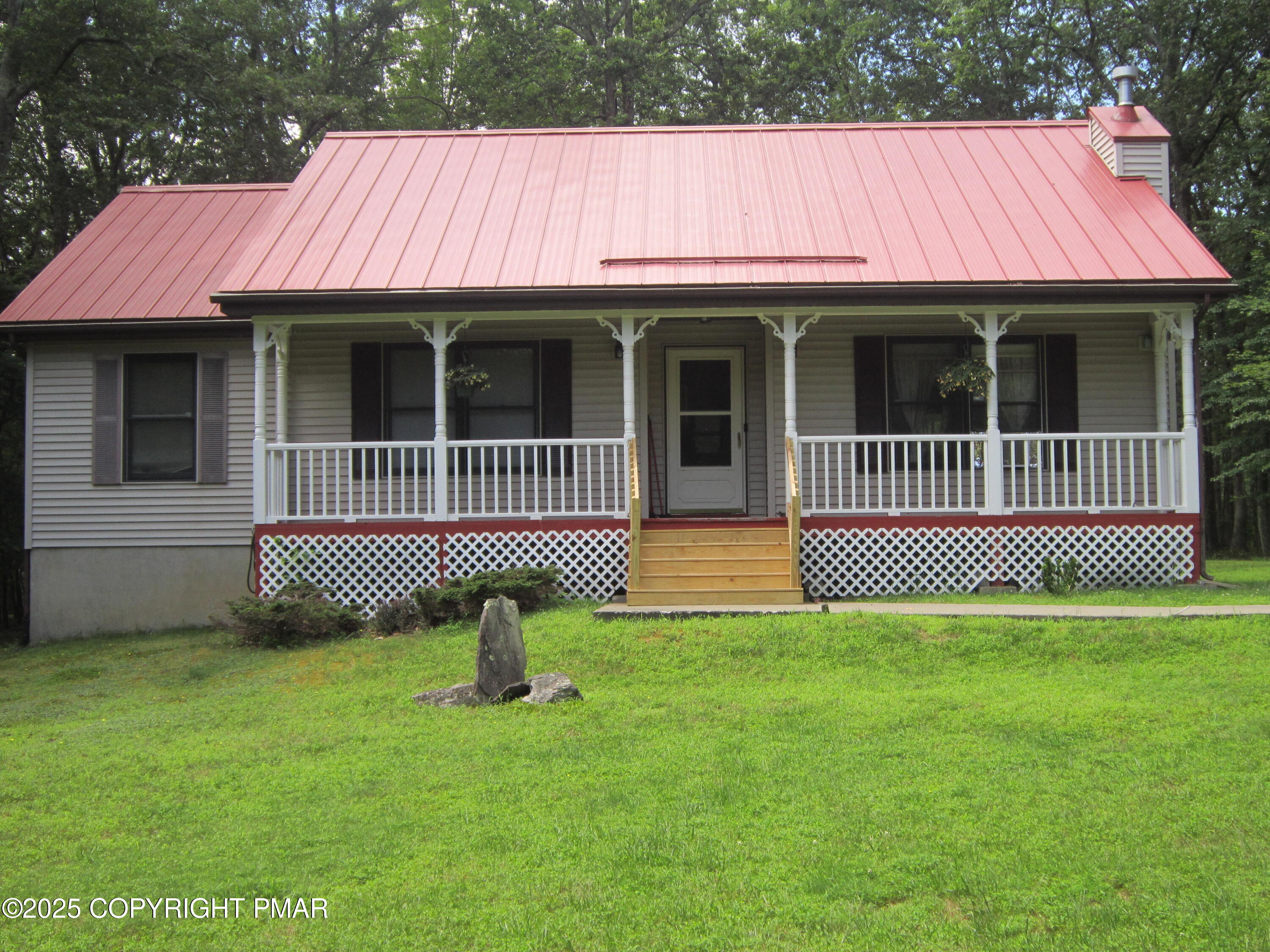 204 Mohican Road Canadensis, PA 18325 - Photo 1 of 20 a view of a house with a deck and a yard