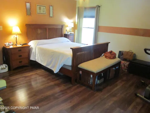 a bed room with a bed and a night stand