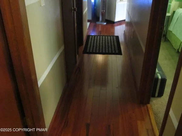 a white toilet sitting next to a shower curtain