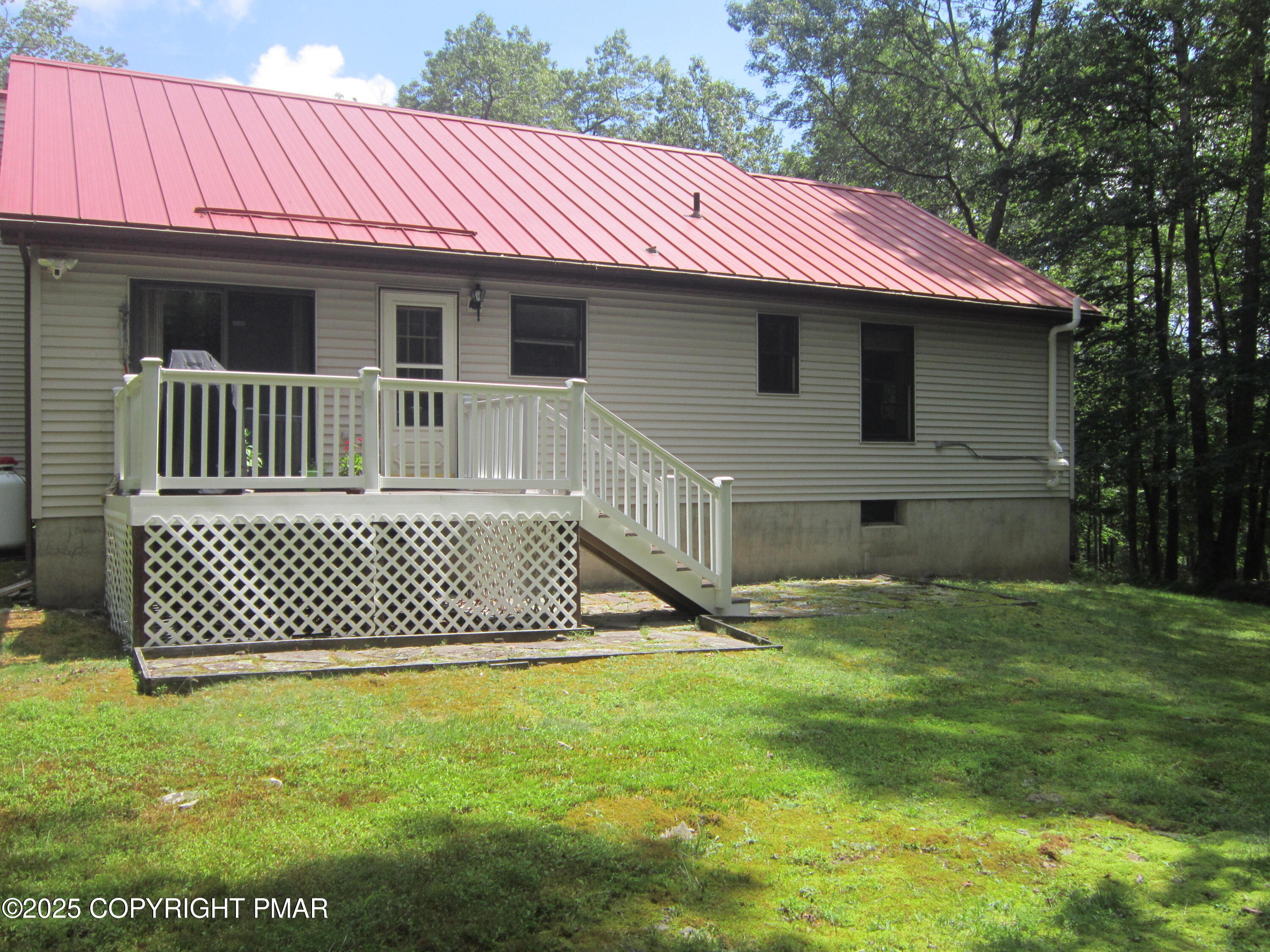 204 Mohican Road Canadensis, PA 18325 - Photo 3 of 20 a front view of a house with a garden