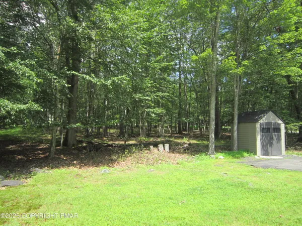 a backyard of a house with lots of green space