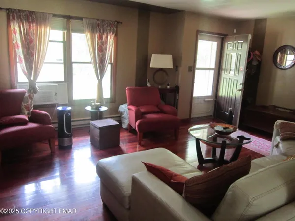 a living room with furniture and a large window