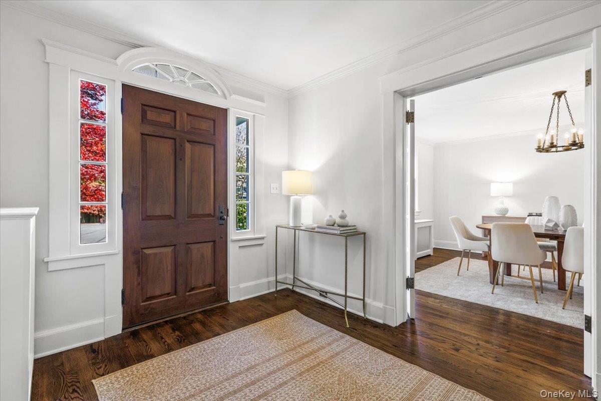36 Intervale Place Rye, NY 10580 - Photo 4 of 41 The commanding front door adorned with timeless glass elements pristinely maintained.